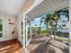 Balcony with wood-look flooring with stunning water views and outdoor seating area at 691 Linley St, Longboat Key, FL 34228