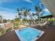Outdoor deck showcases hot tub, chairs, and a scenic view with palm trees, a great spot for relaxing or entertaining at 691 Linley St, Longboat Key, FL 34228