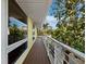Outdoor deck with expansive windows captures the scenic view and natural light, an inviting spot for relaxing and enjoying the outdoors at 691 Linley St, Longboat Key, FL 34228
