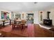 Dining room with a rustic table, wood bench, and a view to the outside at 691 Linley St, Longboat Key, FL 34228