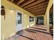 Inviting entryway with brick flooring, a white door, a ceiling detail, and neutral wall color at 691 Linley St, Longboat Key, FL 34228