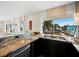 Kitchen featuring granite countertops and a large window with water views at 691 Linley St, Longboat Key, FL 34228