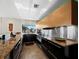 Bright kitchen featuring stainless steel appliances, granite countertops, and ample cabinet space at 691 Linley St, Longboat Key, FL 34228