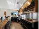 Modern kitchen featuring stainless steel appliances, granite countertops, and ample cabinet space at 691 Linley St, Longboat Key, FL 34228