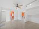 Open floor plan reveals tile floors, ceiling fan, and access to bathroom and bedroom at 691 Linley St, Longboat Key, FL 34228