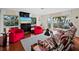 Living room offers stunning water views, stylish furniture, and access to outdoor balcony at 691 Linley St, Longboat Key, FL 34228