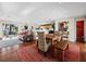 Open concept living room and dining room with a view to a patio at 691 Linley St, Longboat Key, FL 34228