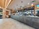 Well-stocked bar area with a stone counter, wooden accents, and ambient lighting at a restaurant at 691 Linley St, Longboat Key, FL 34228