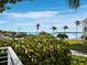 Beautiful water view with palm trees from the balcony of this home at 691 Linley St, Longboat Key, FL 34228