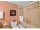 Bright bathroom with tiled shower, neutral tile shower, and decor for a fresh and clean feel at 7860 Palm Aire Ln # 104, Sarasota, FL 34243