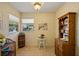 Cozy dining area with natural light, neutral wallpaper, and view of the street, creating a warm atmosphere at 7860 Palm Aire Ln # 104, Sarasota, FL 34243