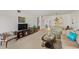 Inviting living room with a seamless flow into the dining area, creating an open and airy atmosphere at 7860 Palm Aire Ln # 104, Sarasota, FL 34243