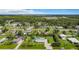 Expansive aerial view of the residential area highlighting mature trees at 8430 Truman St, Englewood, FL 34224