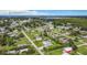 Wide aerial shot of the community showcasing lush greenery and neighborhood streets at 8430 Truman St, Englewood, FL 34224