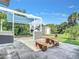 Backyard patio featuring concrete furniture with table and attached bench seating at 8430 Truman St, Englewood, FL 34224