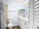 Bathroom featuring a tiled shower, modern vanity, and a mirrored medicine cabinet at 8430 Truman St, Englewood, FL 34224