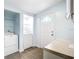 Functional laundry area equipped with washer, dryer, shelving, a utility counter and convenient exterior access at 8430 Truman St, Englewood, FL 34224