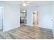 Bright living room with light-colored paint, stylish flooring, and easy access to the kitchen at 8430 Truman St, Englewood, FL 34224