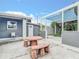 Outdoor patio with seating and access to the back of the house at 8430 Truman St, Englewood, FL 34224