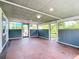 Enclosed sunroom with tile floor, windows overlooking the yard, and a paneled ceiling at 8430 Truman St, Englewood, FL 34224