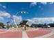 Traffic circle adorned with a shell sculpture and street lighting in a business district at 8430 Truman St, Englewood, FL 34224