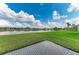 Lush green lawn and lake view, perfect for outdoor enjoyment at 9828 58Th E St, Parrish, FL 34219