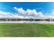 Scenic backyard view with a tranquil lake, and well-maintained landscaping at 9828 58Th E St, Parrish, FL 34219