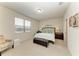 Bright bedroom with a window, neutral decor, and comfortable furnishings at 9828 58Th E St, Parrish, FL 34219