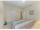 Bedroom with closet and ensuite bathroom access, providing convenience and privacy at 9828 58Th E St, Parrish, FL 34219
