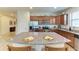 Bright kitchen with a large island, stainless appliances, granite countertops, and ample cabinet space at 9828 58Th E St, Parrish, FL 34219