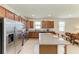 Well-lit kitchen featuring stainless steel appliances, granite counters, and plenty of cabinet space at 9828 58Th E St, Parrish, FL 34219