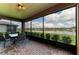 Covered lanai area with lovely lake view at 9828 58Th E St, Parrish, FL 34219
