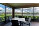 Screened-in lanai featuring a peaceful water view and outdoor seating at 9828 58Th E St, Parrish, FL 34219