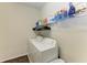 Well-equipped laundry room with a modern washer and dryer for efficient cleaning at 9828 58Th E St, Parrish, FL 34219
