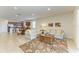 Open-concept living area shows the kitchen, dining area, and comfortable seating area with stylish decor at 9828 58Th E St, Parrish, FL 34219