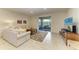 Cozy living room with comfortable seating and sliding door access to lanai at 9828 58Th E St, Parrish, FL 34219