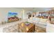 Open-concept living room and kitchen with tile floors and neutral decor at 9828 58Th E St, Parrish, FL 34219