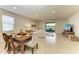 Living room with an outdoor view and elegant dining set at 9828 58Th E St, Parrish, FL 34219