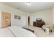 Spacious main bedroom featuring a TV, seating area, and ensuite bathroom with modern fixtures at 9828 58Th E St, Parrish, FL 34219