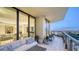 Spacious condo balcony, offering panoramic views of the city, ocean, and beautiful blue sky at 1241 Gulf Of Mexico Dr # 1005, Longboat Key, FL 34228