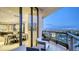 Spacious balcony features outdoor seating and stunning views of the city skyline and bay at 1241 Gulf Of Mexico Dr # 1005, Longboat Key, FL 34228