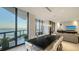 Bright dining area features floor-to-ceiling windows with stunning ocean views at 1241 Gulf Of Mexico Dr # 1005, Longboat Key, FL 34228