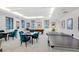 Game room featuring a pool table, ping pong, and sitting area, with natural light from large windows at 1241 Gulf Of Mexico Dr # 1005, Longboat Key, FL 34228