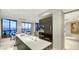 Open concept kitchen with ocean views, adjacent dining and living spaces at 1241 Gulf Of Mexico Dr # 1005, Longboat Key, FL 34228