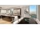 Contemporary kitchen with island, bar seating, and adjacent dining area at 1241 Gulf Of Mexico Dr # 1005, Longboat Key, FL 34228