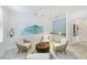 Inviting lounge area with comfortable seating, decorative artwork, and a refreshment station for relaxation at 1241 Gulf Of Mexico Dr # 1005, Longboat Key, FL 34228