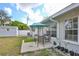 Charming backyard with a patio set under an umbrella, and a view of the well-maintained lawn at 1409 2Nd E Ave, Bradenton, FL 34208