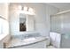 Clean bathroom featuring a modern vanity with granite countertop and glass-enclosed shower at 1409 2Nd E Ave, Bradenton, FL 34208