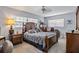 Comfortable bedroom featuring cozy decor, large windows, and ceiling fan at 1409 2Nd E Ave, Bradenton, FL 34208