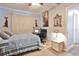 Relaxing bedroom featuring a work space with a large mirror and warm lighting at 1409 2Nd E Ave, Bradenton, FL 34208